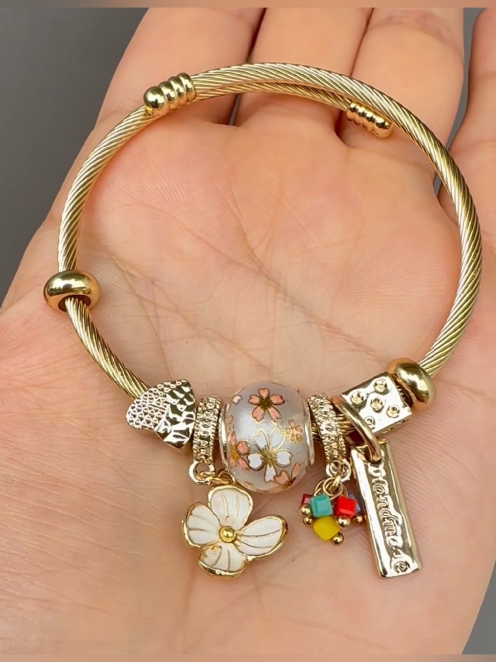 Gold-Tone Floral Charm Bangle Bracelet with Enamel Flower Bead